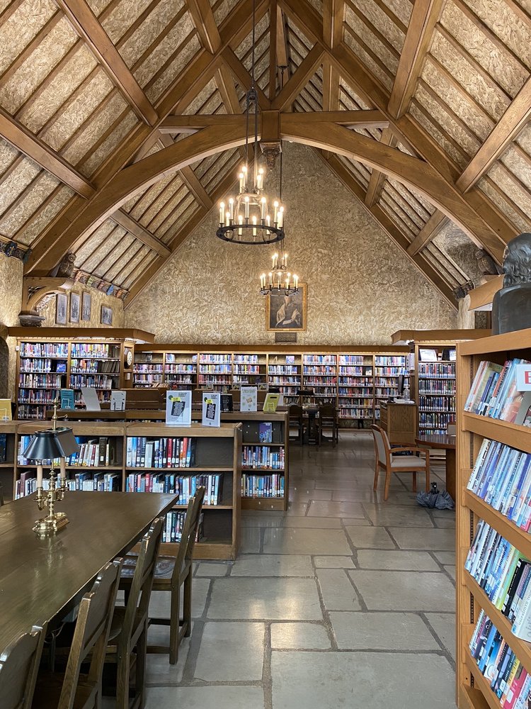 old library with vaulted ceiling and wood beams